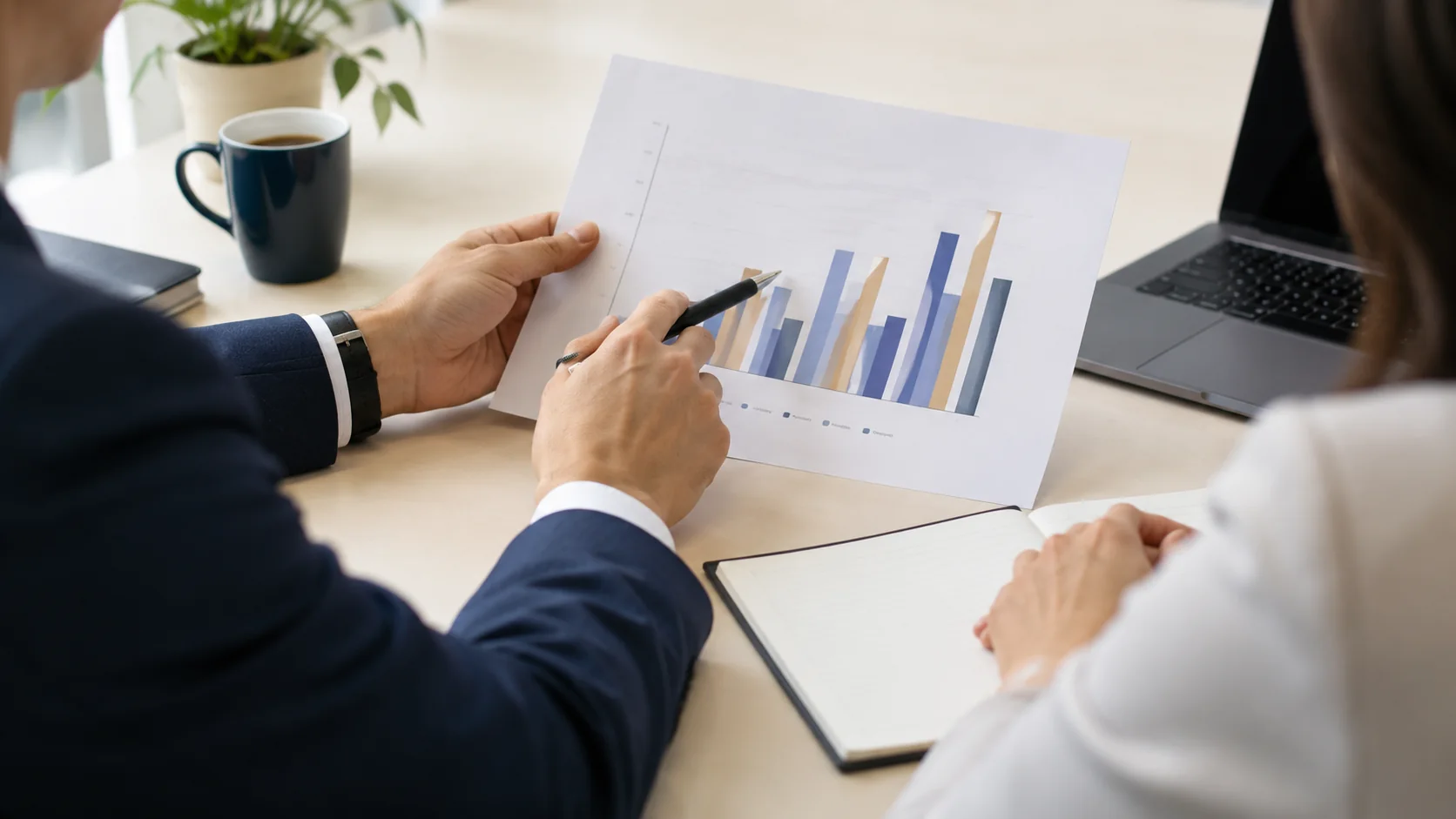 Illustrative adviser explaining a clear financial chart to a client